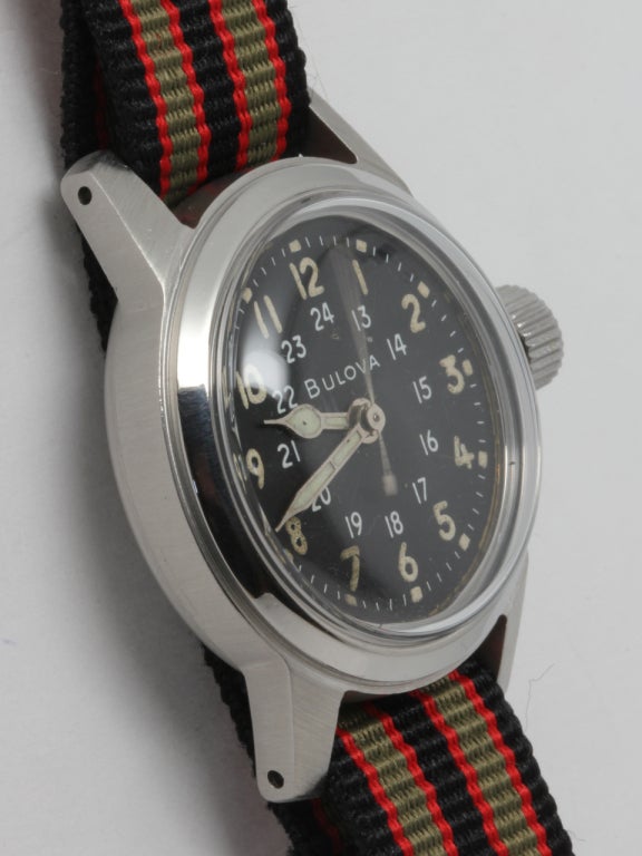 Bulova base metal military-issue wristwatch, circa 1940s. Base metal non reflective case measuring 22 X 40mm. Black dial with inner 24-hour indications, luminous numerals and hands. 15-jewel manual-wind movement with sweep seconds and hack feature.