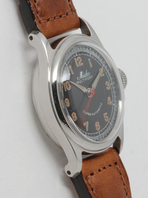 Mido stainless steel Multifort automatic wristwatch, circa 1950s. Medium size model, 28 X 35mm, screw back case with bowed lugs and very pleasing original gloss black dial with luminous figures and hands, and red sweep seconds hand. Powered by a