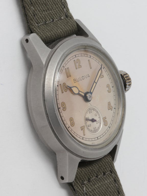 Bulova base metal WWII-era military-issue wristwatch, circa 1942. With original patinaed dial with Arabic numerals. Case dimensions 32 x 39mm. 15 jewel manual-wind movement with subsidiary seconds. Offered on a military or NATO style strap.

Like