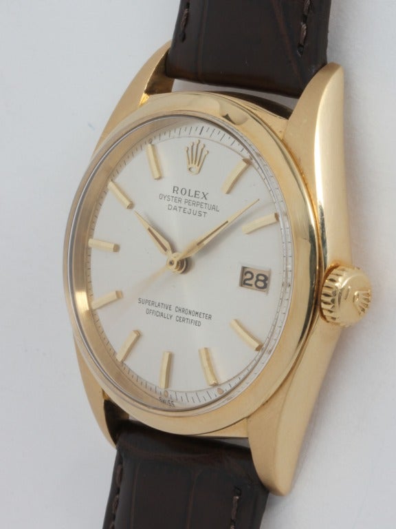 Rolex 18 yellow gold Datejust wristwatch, Ref. 1601, circa 1964. 36mm full-size man's model with smooth bezel, acrylic crystal and beautiful original satin silvered pie-pan dial with gold applied indexes. Calibre 1570 self-winding movement with