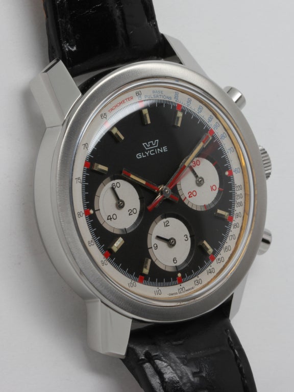 Glycine stainless steel three-register oversize manual-wind chronograph wristwatch, circa 1960s. Large and thick 40 X 46mm case with wide flat bezel and beautiful original black and white dial with red accents, similar to the famed Rolex Paul Newman