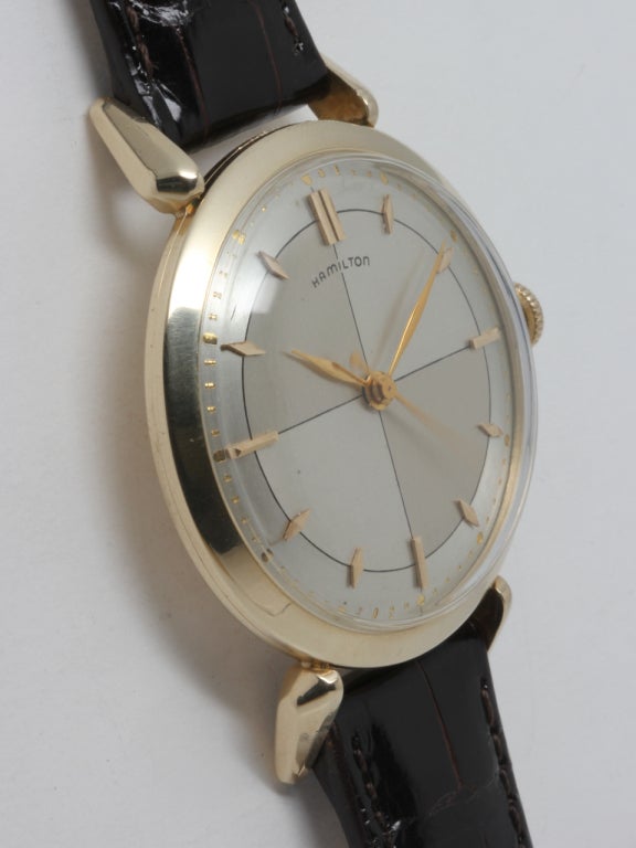 Hamilton gold filled Rodney wristwatch, circa 1950s. 34.5 X 44mm case with extended lugs and very pleasing two-tone satin dial with cross-hairs design and applied indexes, pearl minute track, and leaf hands. 17-jewel calibre 735 movement with sweep