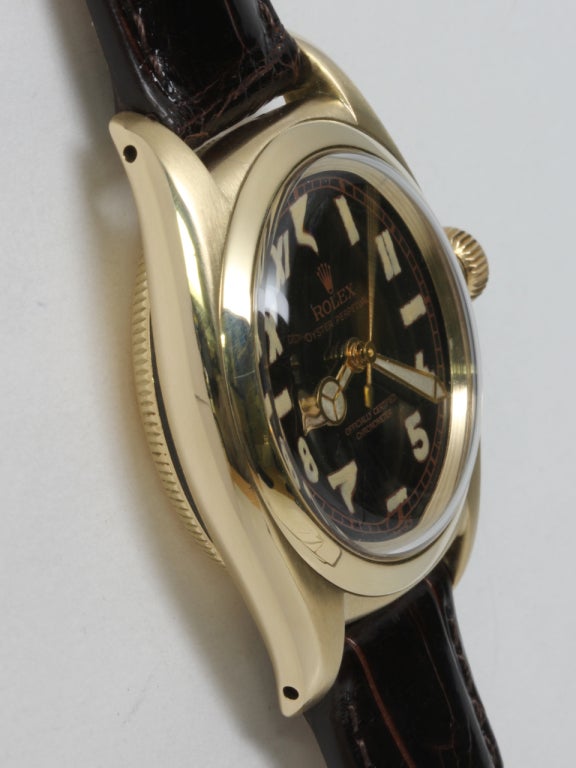 Rolex 14k yellow gold Bubbleback wristwatch, circa 1940s. 32mm case with smooth bezel, screw back and period-style screw down crown. With beautifully restored glossy black so-called 