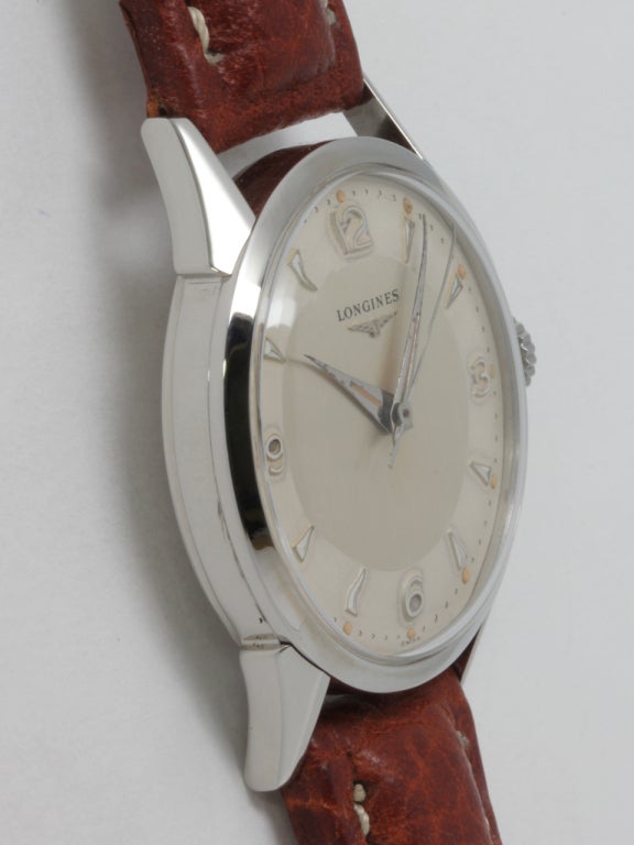 Longines stainless steel wristwatch, 33 X 38mm case with sculpted lugs and screw back, circa 1950s. With original two-tone matte silvered dial with raised indexes, Longines logo and dauphine hands. Powered by Longines 17-jewel manual-wind movement
