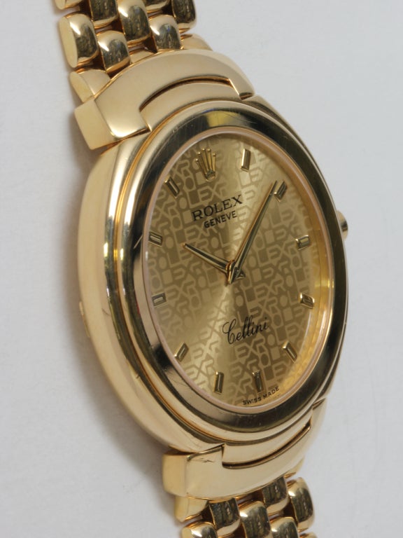 Rolex 18k yellow gold Cellini bracelet watch, Ref. 6623, circa 1993. Large 36mm model with hinged hooded lugs, champagne jubilee dial with applied gold indexes, sapphire crystal, signed crown and heavy link bracelet with hidden clasp. Quartz