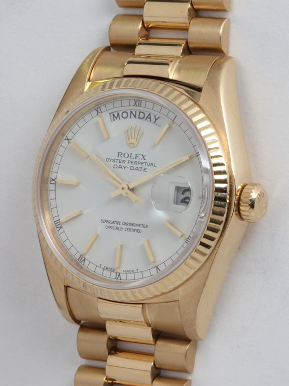 Rolex 18k yellow gold Day-Date wristwatch, Ref. 18038, serial number 5.7 million, circa 1978. 36mm full-size man's model with fluted bezel, sapphire crystal, and beautiful original white dial with applied indexes. Self-winding calibre 1555 movement
