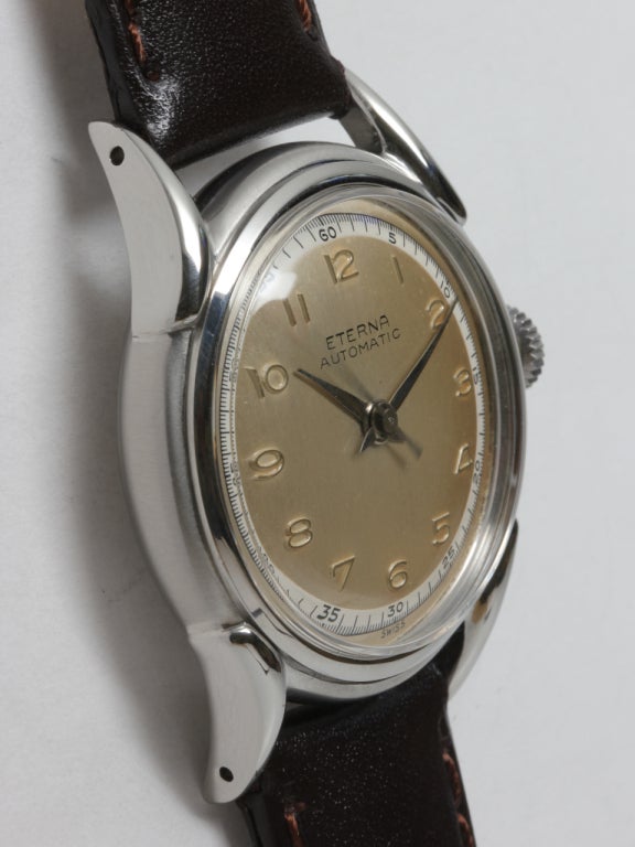 Eterna stainless steel Eternamatic automatic wristwatch, circa 1950s. 33 x 41mm screw back case with extended curved lugs. Original two-tone matte silvered dial with raised Arabic indexes outer seconds track, tapered hands, self-winding movement