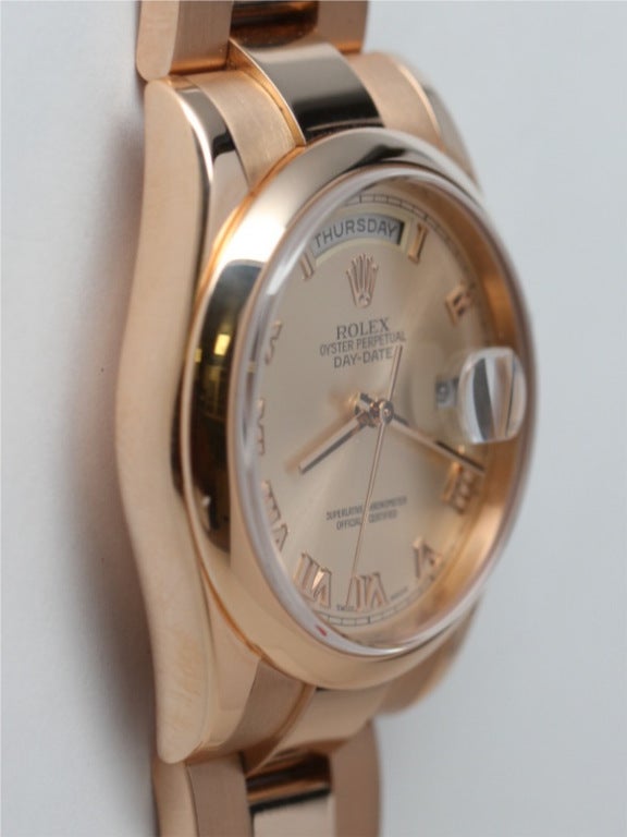 Rolex 18k rose gold Day-Date President wristwatch, Ref. 118235, 36mm full size man's model with domed bezel, sapphire crystal, and recent heavier-designed hidden clasp Oyster President bracelet. Featuring popular Roman Rose dial with heavy Roman