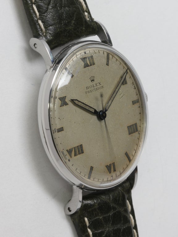 Rolex stainless steel oversized wristwatch, circa 1940s, 35 x 40mm case with extended lugs and great looking original matte silvered dial with patinaed luminous Roman numerals and matching luminous hands. Powered by a 17-jewel manual-wind calibre 10