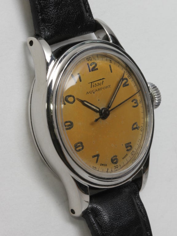 Tissot stainless steel Aquasport wristwatch, medium-size with screw back and original warmly patinaed dial with luminous indexes and hands, circa 1950s. Powered by a 17-jewel manual-wind movement with sweep seconds. Great looking medium-size vintage