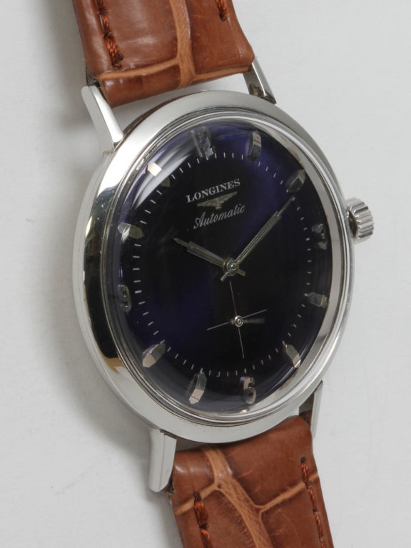 Longines stainless steel automatic wristwatch, circa 1960s. 35mm case with screw back, beautifully restored blue dial with applied indexes, Longines logo and baton hands. Self-winding movement with subsidiary seconds. Offered on your choice of