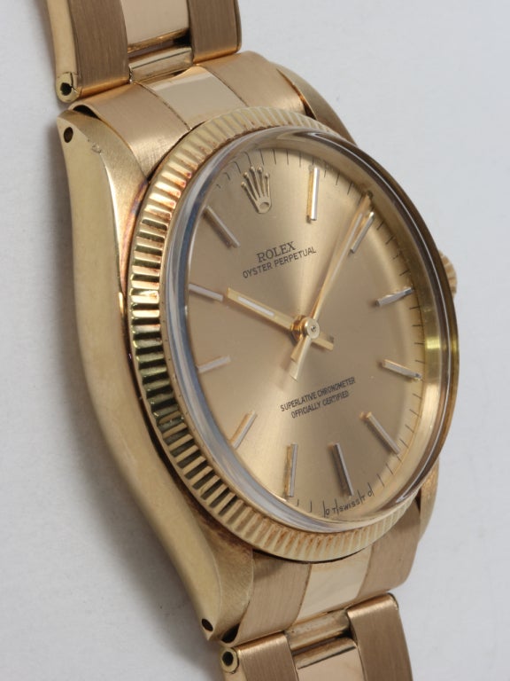 Rolex 14k yellow gold Oyster Perpetual wristwatch Ref. 1005, serial 3.8 million, circa 1974. 34mm case with fluted bezel and acrylic crystal. Original champagne dial with applied indexes and baton hands. Powered by self-winding chronometer-rated