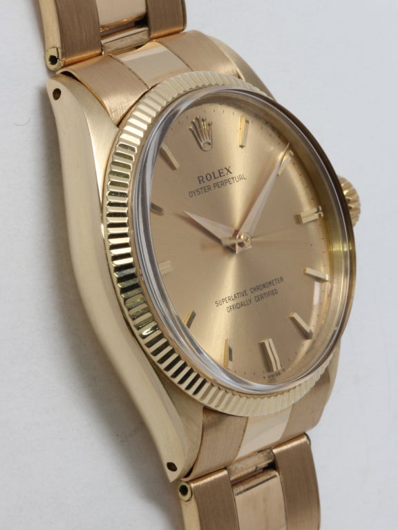 Rolex 14k yellow gold Oyster Perpetual wristwatch, Ref. 1005, serial 1.0 million, circa 1963. 34mm case with fluted bezel and acrylic crystal. Original champagne dial with applied indexes and baton hands. Powered by self-winding chronometer-rated
