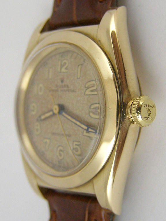 Rolex 14K YG Oyster Perpetual Bubbleback ref#  3131 circa 1940's with 3<br />
piece case, smooth bezel, screw down caseback and screw down period<br />
bubbleback crown. Very pleasing original patina'd dial with luminous numbers<br />
and