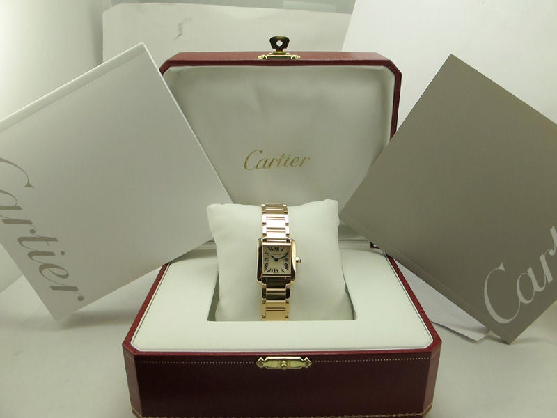 Cartier 18K PG Tank Francaise lady small size. Battery operated quartz movement. Fully linked, minty condition with original Cartier box and papers. List price approximately $16,500.00