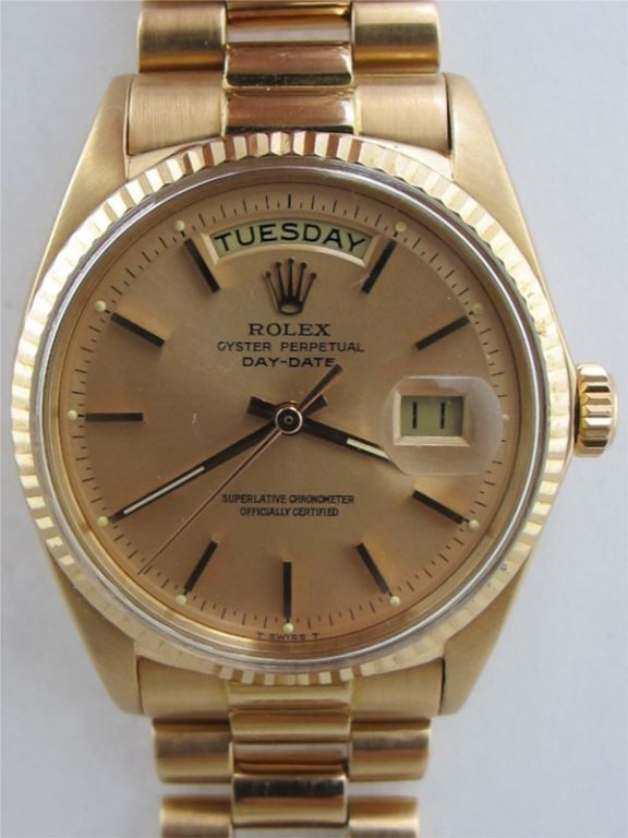 Rolex 18K PG Day Date President ref # 1803 circa 1970's. 36mm diameter full size vintage man's model with 18K PG fluted bezel, beautiful original antique salmon dial with pink applied indexes and pink baton hands. Calibre 1570 self winding
