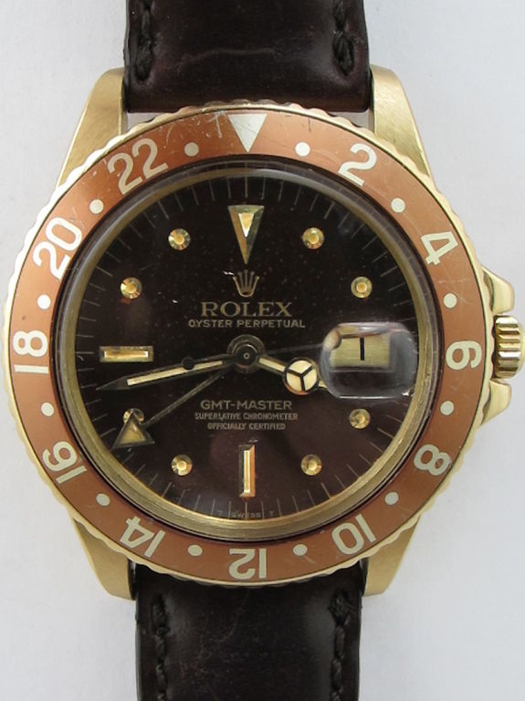 Rolex 18K YG GMT-MASTER ref# 1675 serial# 5.0 million circa 1977 with glossy original rootbeer dial with gold rivet indexes and gilt mercedes hands . Self winding calibre 1560 movement with sweep seconds and date and 24 hour hand. Evenly faded 24