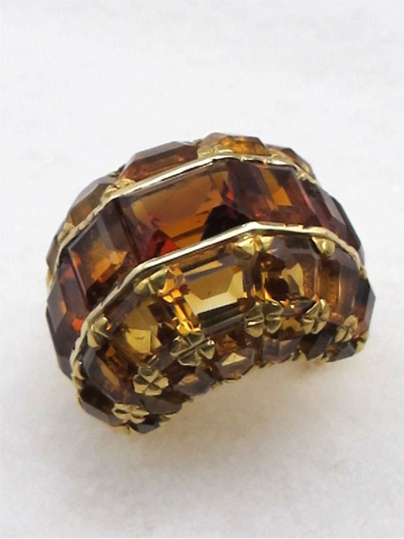 14K Gold cocktail ring with a domed top covered with emerald cut madiera citrine and golden citrine. Set in channels on top & small flower shaped prongs on sides. Fully encrusted with rich tones of amber & honey carmel cut to negotiate the curves of