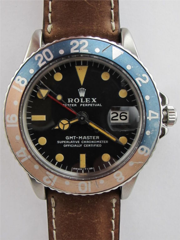 Rolex stainless steel GMT ref 1675 2.9 million serial # circa 1971. Original matte black dial with richly patina'd luminous indexes and matching hands. Faded and worn red and blue so called Pepsi bezel gives a rich tone and character. Offered on