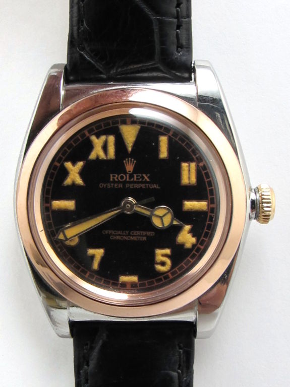 Rolex Stainless Steel & pink gold bubbleback ref #3133 circa 1940's 33mm diameter case with smooth pink gold bezel circa 1940's with beautifully restored black gloss dial with popular 1/2 Roman 1/2 Arabic dial with antique luminous figures and
