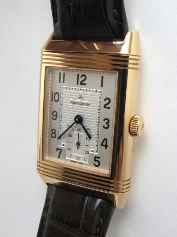 Jaeger Lecoultre 18K PG Reverso XL massive 29 X 47mm oversized model circa 2008 with silver satin textured dial, 17 jewel manual wind movement with subsidiary seconds, broown crocodile strap with LJC Deployment buckle. Mint like new condition
