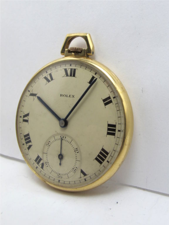 Rolex 18K gold 14 size open face pocket watch circa 1940's. Original matte silver dial with Roman figures and blued steel spade hands. 17 jewel manual wind movement with subsidiary seconds/ Scarce model in excellent condition free of any