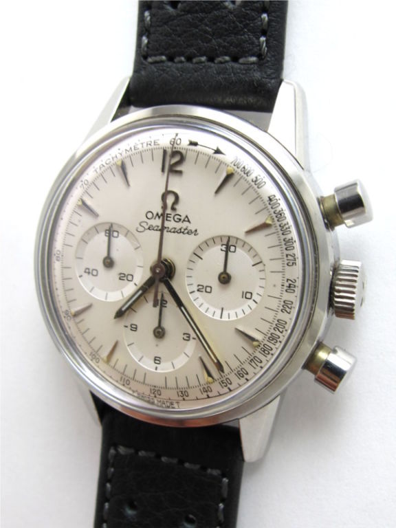 Omega stainless steel Seamaster manual wind chronograph ref #165.004-64 with Omega calibre 321 movement serial # 22 million circa 1964. Beautiful original antiqued silver dial with applied dagger style markers and fancy tachymetre outside ring. Big