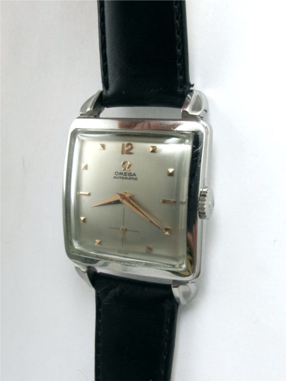 Omega SS oversized square case with large lobed lugs circa 1950's. Nicely restored silver satin dial with gold applied indexes and hands. Self winding bump automatic movement with sweep seconds. Great looking large vintage model.<br />
Stk# 39010
