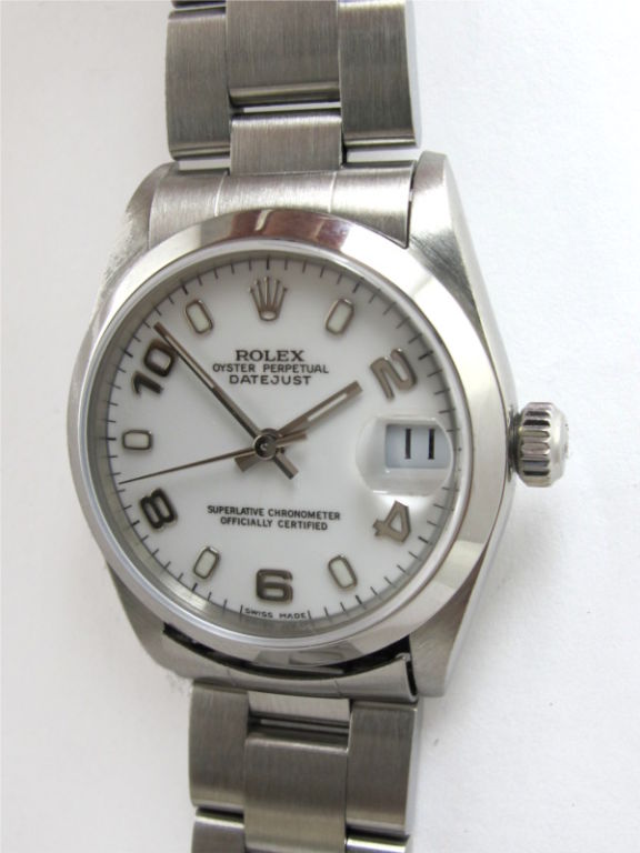 Rolex SS midsize Datejust ref # 78240 31mm diameter case with smooth bezel serial # Y4 circa 2002. White enamel dial with arabic figures. Sapphire crystal, quick set movement with sweep seconds and date. Rolex SS heavy Oyster bracelet.<br />
Stk#