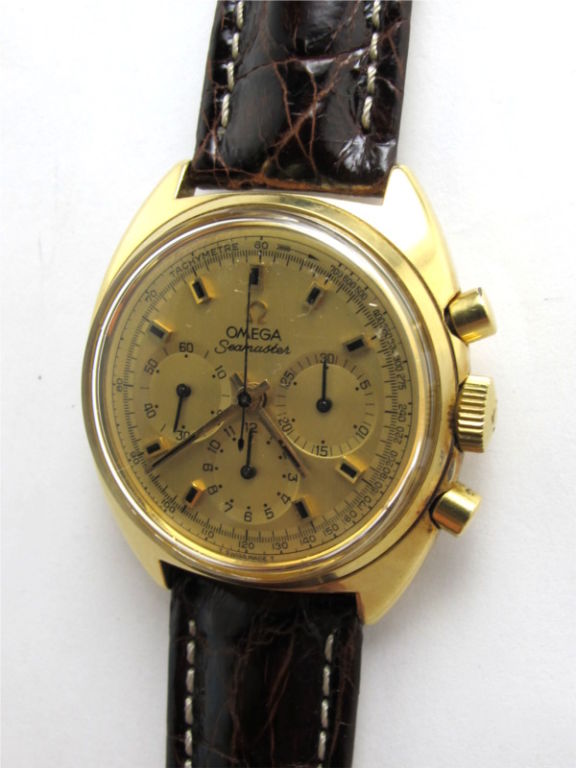 Omega 18K YG Seamaster chronograph ref 145.016 large 37 x 43mm cushion shaped case Calibre 861 3 registers manual wind movement serial# 28.4 million circa 1969, with original champagne dial, pushers and signed Omega crown. With screw down caseback