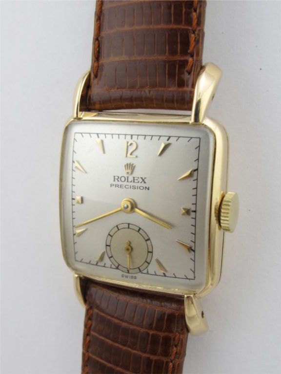 Rolex 14K YG Precision circa 1950's ref 4471 square 26 X 40 mm case with large lobd lugs. Nicely restored 2 tone silver dial with gold raised tapered indexes and gold baton hands. 17 jewel manual wind movement with subsidiary seconds<br />
Stk#