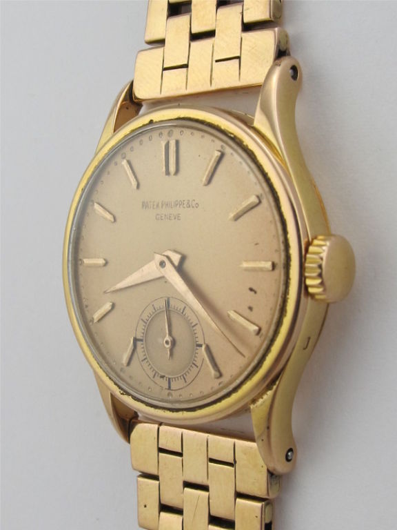 Patek Philippe 18K PG Calatrava modèle ref 96 circa 1950's avec lourd bracelet Gays Frères 18K PG à larges maillons en briques. Modèle très agréable avec cadran saumon antique joliment restauré. Modèle de taille moyenne pour le poignet d'un homme
