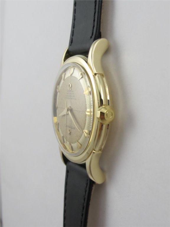 Omega Constellation 14K YG rare exceptional 2 tone textured cross hairs dial with large lotus indexes circa 1950's. Great looking model with rare and beautiful dial, original octagonal signed crown, heavy snap back case with Observatory logo. Great