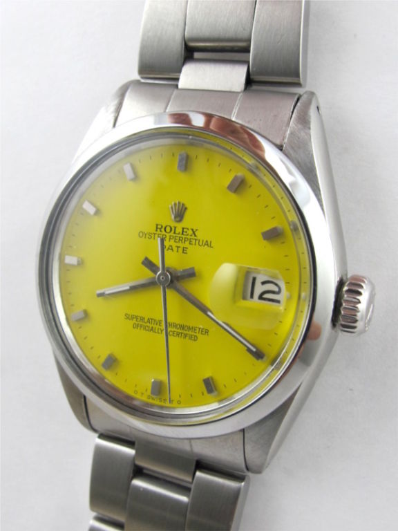 Rolex SS Oyster Perpetual Date ref 1500 34mm diameter case with smooth bezel circa 1970's with custom colored Corvette Yellow dial with applied silver indexes. With Rolex SS heavy Oyster bracelet with deployment clasp. Many other custom dial colors