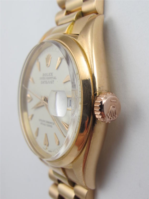 Rolex 18K PG Datejust ref 6605 serial #328,xxx circa 1957. 36mm diameter Oyster case with smooth bezel and beautifully restored antique white dial with eccentric pink applied indexes, tapered hands, and self winding calibre 1065 movement with sweep