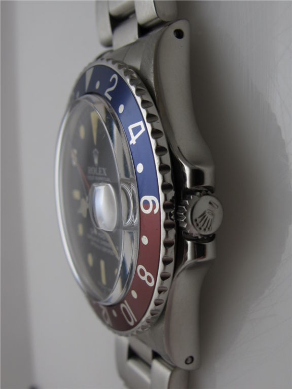 Rolex Gmt-Master ref 1675 circa 1970/71, original matte dial lightly aged, gently faded bezel insert, plastic crystal, matching and correct period Rolex rivet bracelet. Great looking early GMT!<br />
Stk# 40479