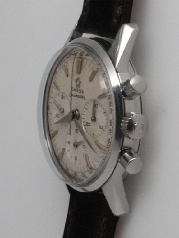 Omega SS Seamaster Chronograph ref # 14364-61 circa 1959, 35mm diameter case with round pushers, signed Omega crown, and screw down caseback stamped Seamaster and Waterproof with original patina'd silver satin dial with tapered luminous hands and