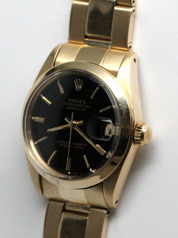 Rolex 14K YG Datejust midsize ref # 6827. 31mm diameter case with smooth bezel and acrylic crystal, serial# 5.0 million circa 1977 with custom colored antique bronze dial with gold applied indexes and gold baton hands. Self winding movement with