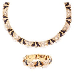 A French Gold Onyx Diamond and Ivory Set