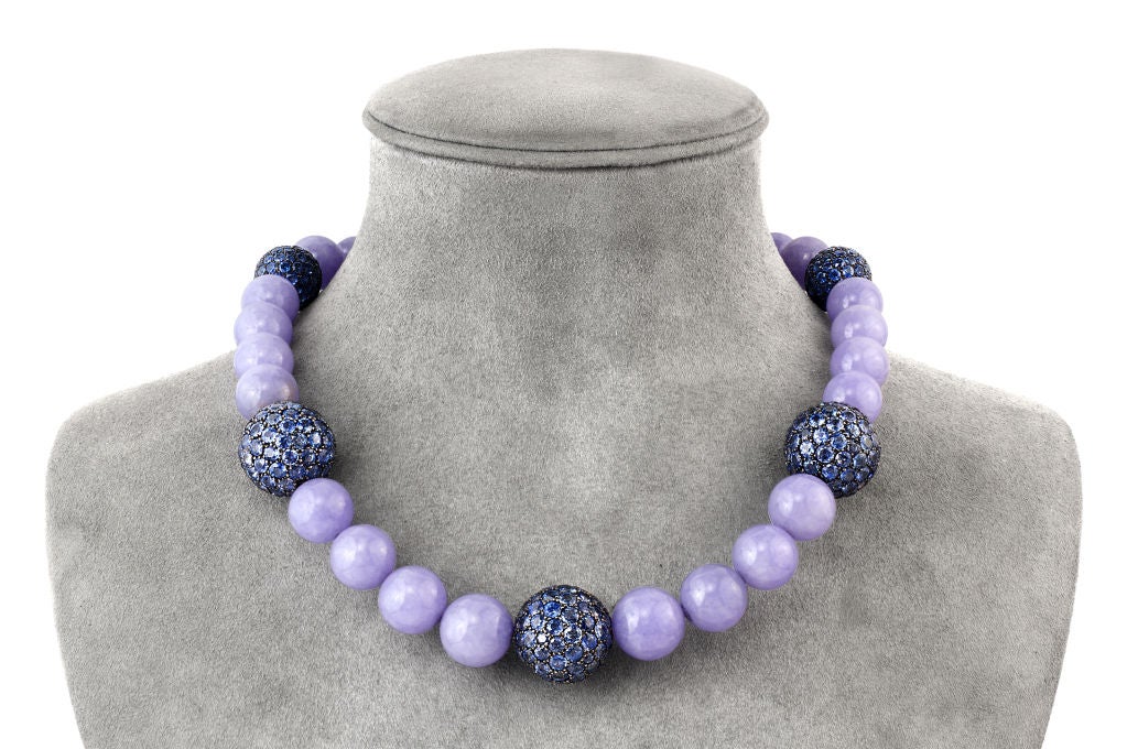 Highly prized for its uniqueness and rarity, pastel colored lavender Jade, in this quality, is truly considered a gemstone.  This perfectly matched Jade necklace with 28 very large and very rare beads is a high fashion statement in the rarefied