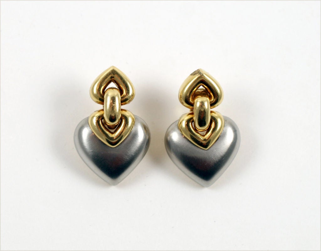 “Bulgari” 18kt yellow and white gold earrings with clip and post. Composed of two heart-shaped pieced; yellow gold on the upper-portion and yellow on the lower. Gross weight 29.1g