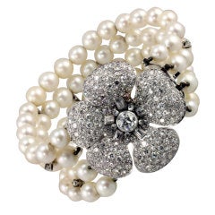 Multi Stranded Pearl Bracelet with Unique Diamond Flower