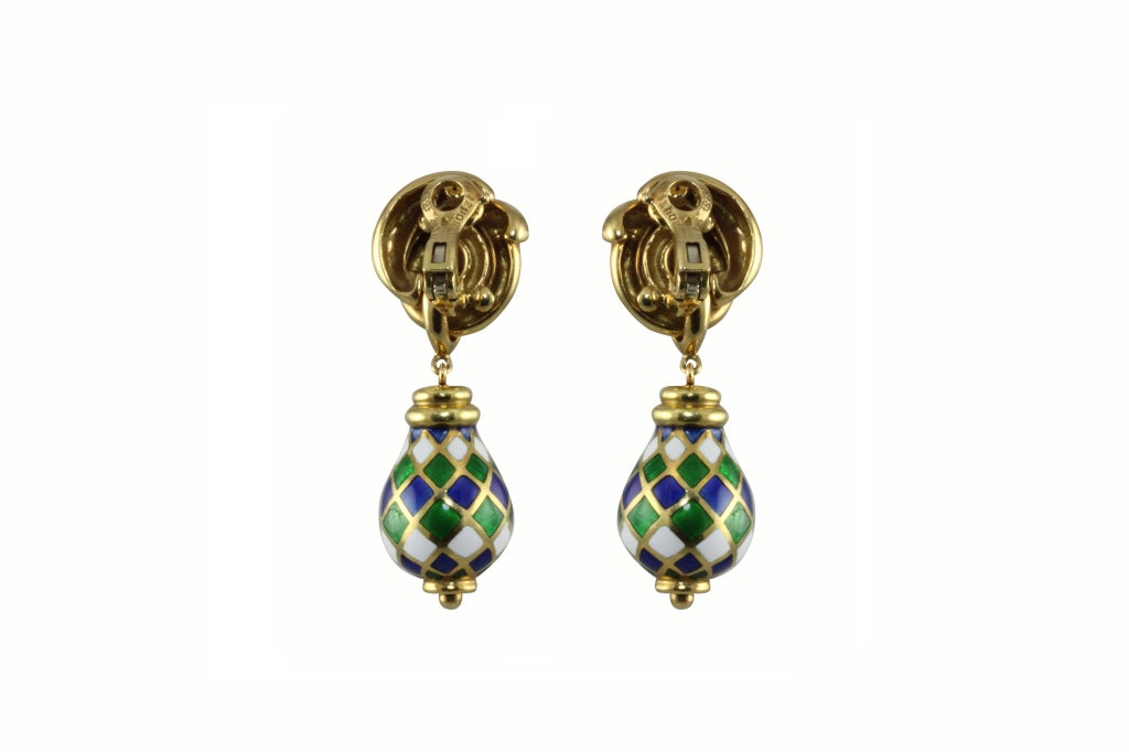 A unique pair of 18k yellow gold drop enamel earrings. The top portion is designed in a coiled knot. Attached to the top is a pear shaped drop of green, blue and white enameled gold in an alternating diamond”harlequin