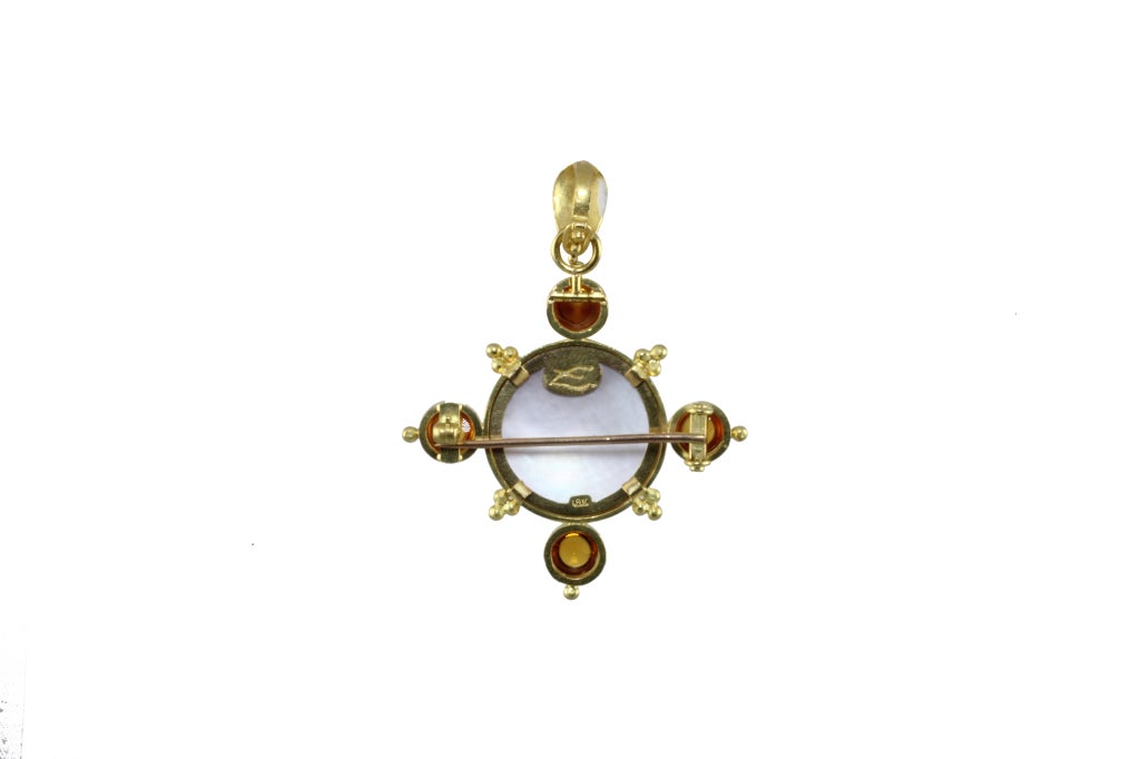 One Elizabeth Locke 19k Yellow GoldBrooch/Pendant. The center is a 