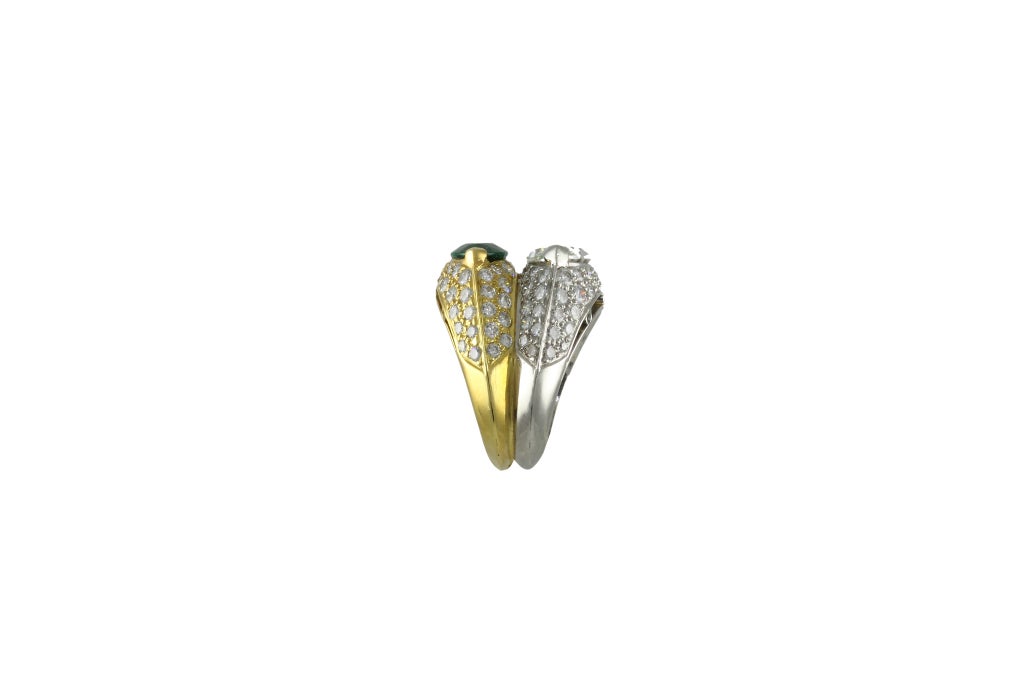 One Platinum 18 K Yellow Gold, Diamond and Emerald Ring. The center marquis diamond is 2.73 carats and is G color and VS2 clarity.
The center marquis Emerald is Zambian weighing 2.07 carats.
The ring is set with 3.01 carats f pave diamonds F/G in