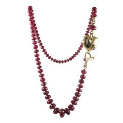 Long Faceted Ruby Bead and Gold Heart Necklace