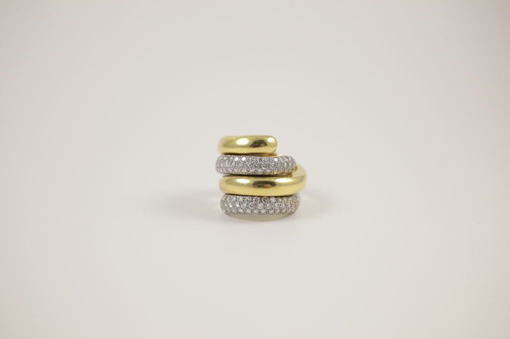 “Marlene Stowe” 18k yellow and white gold ring, with two yellow gold bands and two white gold with pave diamonds.