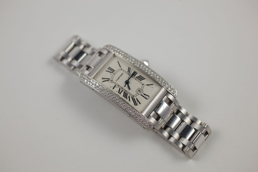 Cartier “Tank Americaine” in 18k white gold with two-rows of pave diamonds that run vertically along the case. Automatic Movement (Americaine’s currently out on the market come with Quartz movement standard) #259344CD