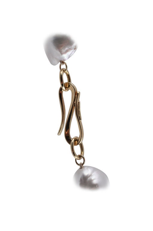This magnificent strand is comprised of 19 Baroque South Sea pearls. The luster quality is very high and the pearls carry an iridescent silver white glow. The Pearls start at 15mm and range at the largest pearl, 19.5 mm. The pearls are clasped with