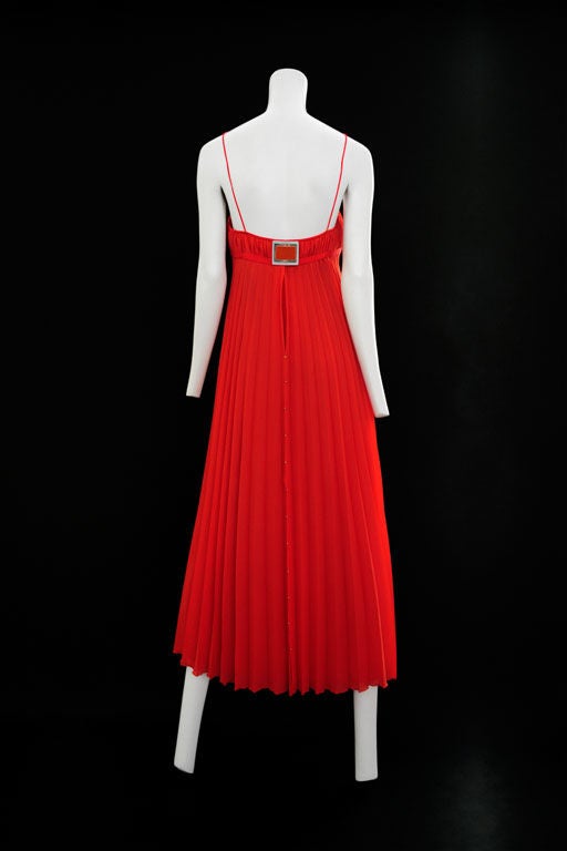 Red pleated georgette gown with aluminum bodice detail. c. 1970's